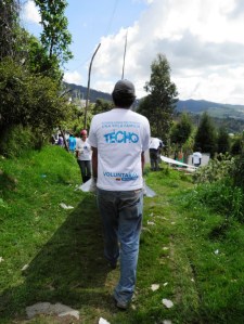 Volunteers carrying supplies to another site