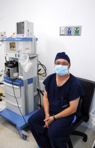 Dr. Julio Arrango keeps a close eye on his patient