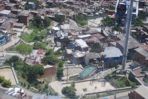 kids enjoying the pool in the barrio beneath the metrocable