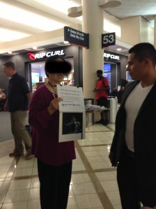 Woman soliciting signatures for United Nations petition against organ harvesting