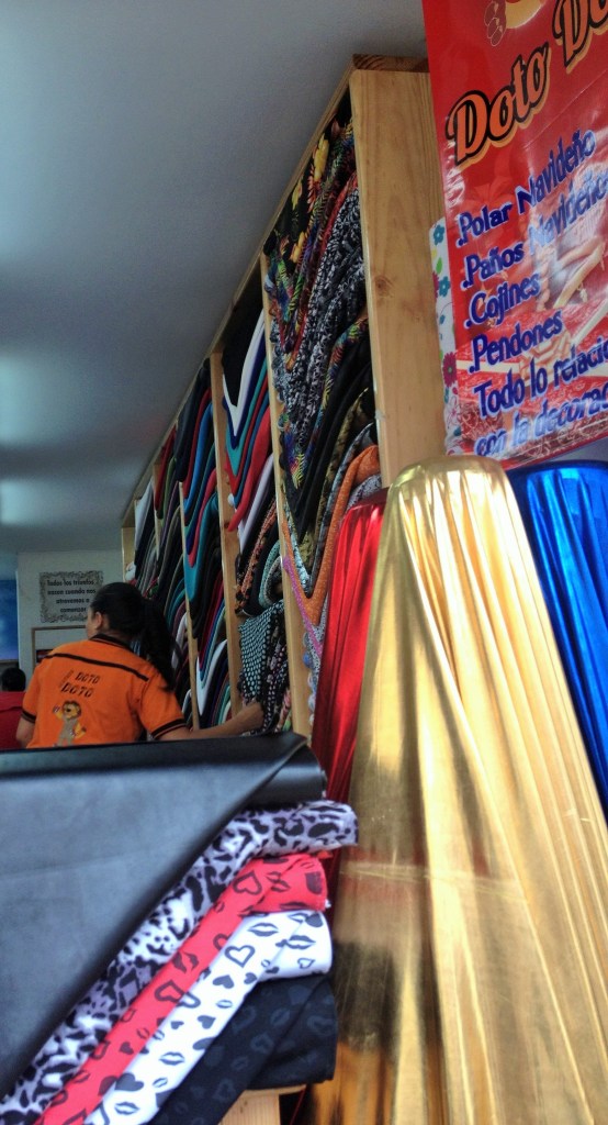many shops are small but piled high with fabric